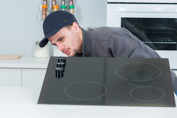 installing new induction hob in clients kitchen