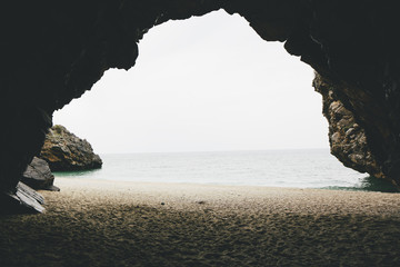 View from a cave on the beach in Greece