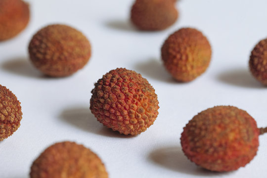 Lychees on a white.