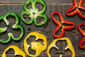 Sliced red, yellow and green bell peppers