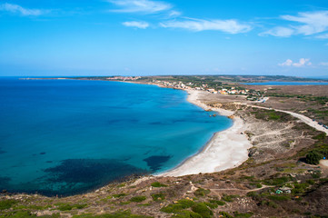 View of the beach, the sea and the old tower (San Giovanni di Sinis, Sardinia)