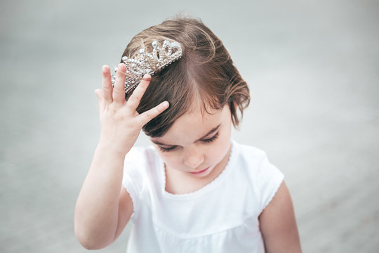 Portrait of a beautiful little girl with a diadem