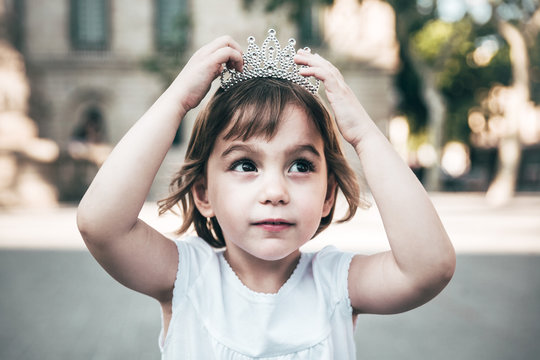 Portrait of a beautiful little girl with a diadem