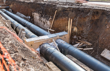 Repair work of heating duct. Replacement pipes of the heating main in summertime