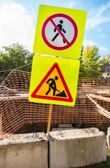 Road signs at the construction site in summer day