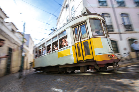 speeding historic tram lisbon portugal