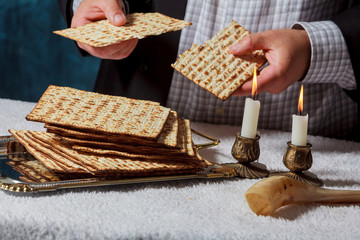 Jewish men is blessings matza for the Jewish holiday of Passover Seder meal