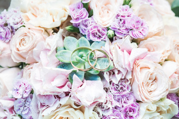 wedding rings on flowers