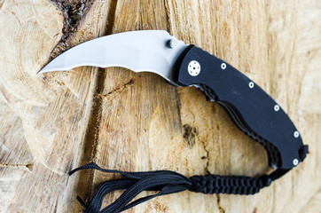 Photo of the knife in an unusual perspective. Photo of the knife at an angle. Folded knife.