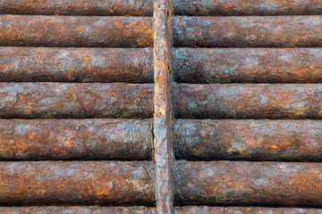 rusted discarded industrial pipes