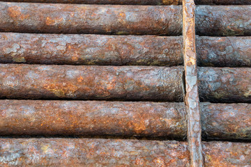 rusted discarded industrial pipes