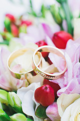 wedding rings on flowers
