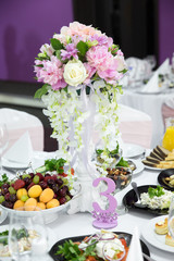 luxury table set for wedding with flowers and number 3