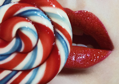 red shiny lips and spiral candy closeup