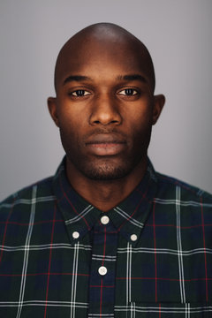 Close up of a black young man looking at camera