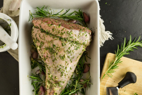 Leg of lamb with herb, garlic and oil rub, overhead view