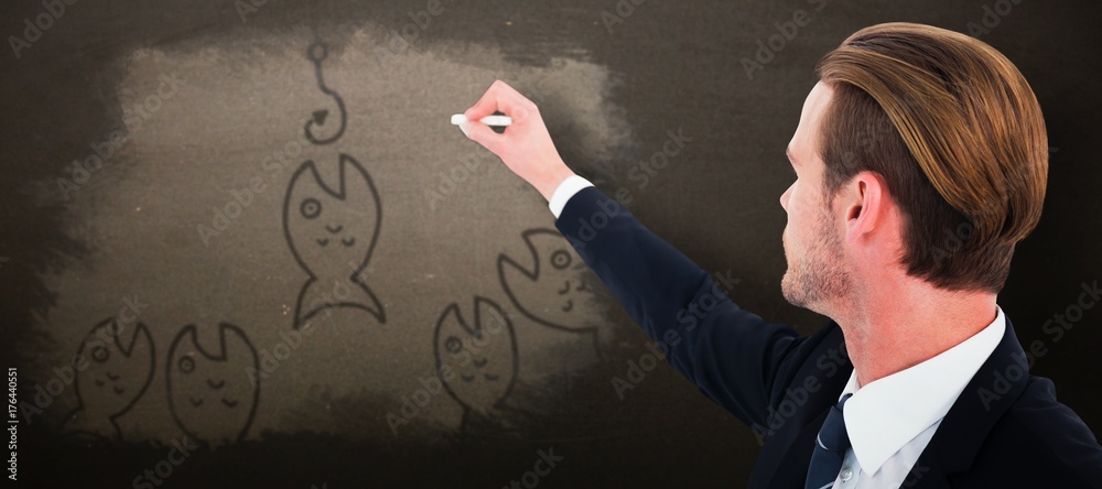 Poster Composite image of well dressed businessman writing with chalk