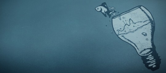 Composite image of fish jumping out of light bulb bowl