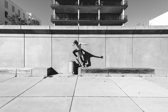 Skater jumps over dustbin