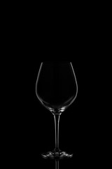 Red wine glass  on the dark background