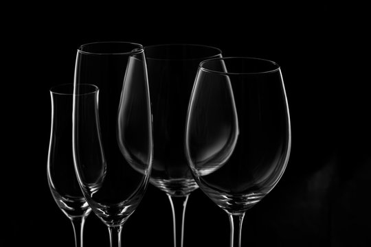 Glassware selection with wine, champagne and liquour glasses  on the dark background