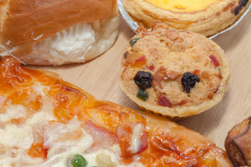 variety of bakery on wooden plate