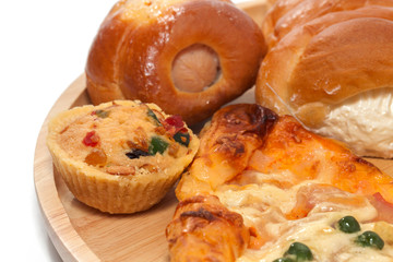 variety of bakery on wooden plate