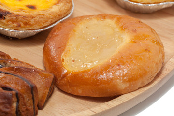 variety of bakery on wooden plate