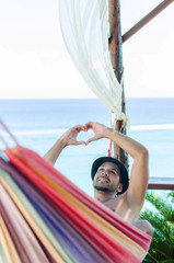 Man sending heart with hands © focusandblur