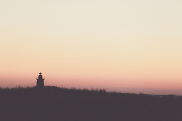 Fototapeta na wymiar lighthouse sunset silhouette