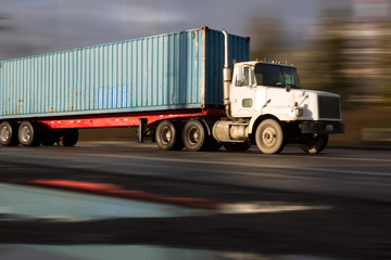 Speeding blue container truck