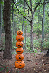 Stack of pumpkins in the woods