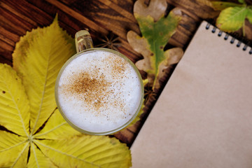 Autumn flatlay with fallen leaves, spices and craft blanknote