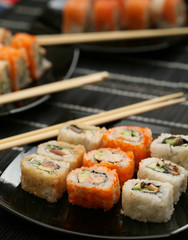 Japanese sushi on black plate