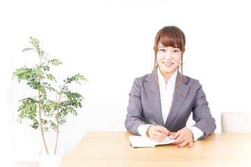 Business woman taking notes