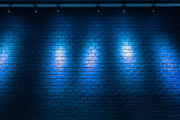blue brick wall background with light bulb