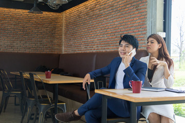 Asian business man and asian business woman.