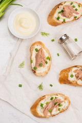 Italian cuisine. Bruschetta with tuna, onion, and mayonnaise.