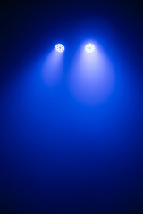 Stage light, spotlight strike through the darkness, Spotlights scene light effects, light show at the Concert.