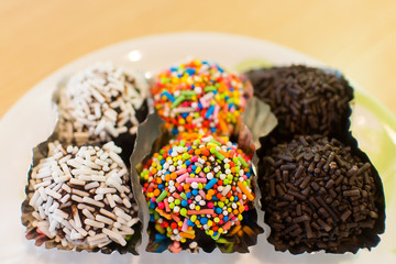 chocolate ball with topping in paper cup