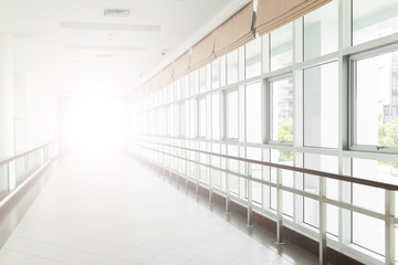 empty long corridor in the modern office building. background