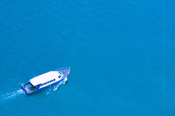 Fototapeta premium Aerial view of sailing boat at sea.