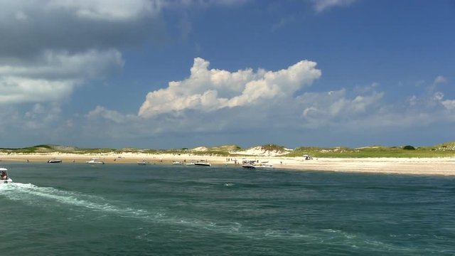 Ocean beach cape cod sand dunes summertime recreational boating vacation aerial drone quad flyover 