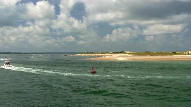 Ocean beach cape cod sand dunes summertime recreational boating vacation aerial drone quad flyover 
