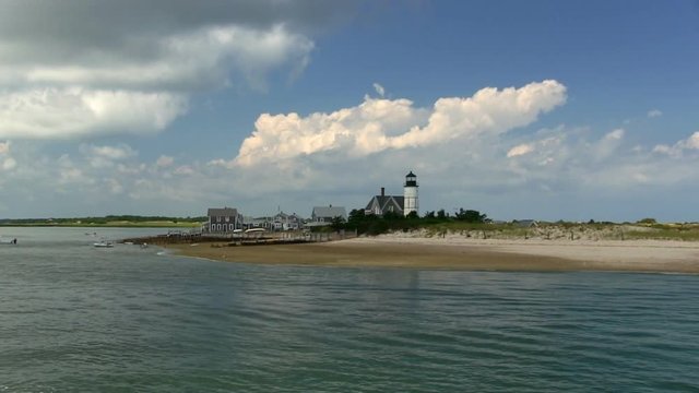 Ocean beach cape cod sand dunes summertime recreational boating vacation aerial drone quad flyover 