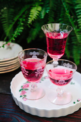 Colorful alcoholic cocktails in beautiful vintage glassware