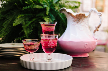 Colorful alcoholic cocktails in beautiful vintage glassware