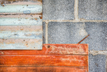 the gray brick and  wood and galvanized iron sheets old wall. For wallpaper.