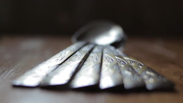 tablespoon on the heap/A set of table spoons on the table