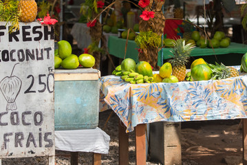 Exotic fruits sold on the road, market stall, street hawker in French Polynesia, Moorea 
